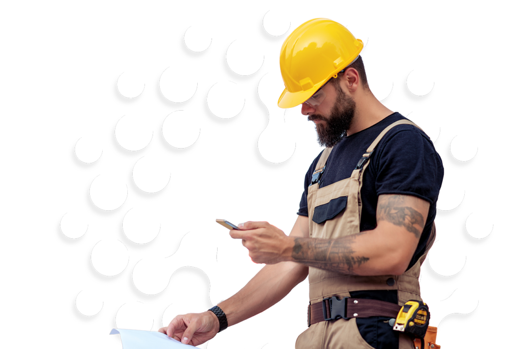 A manin hard hats and holding phone.