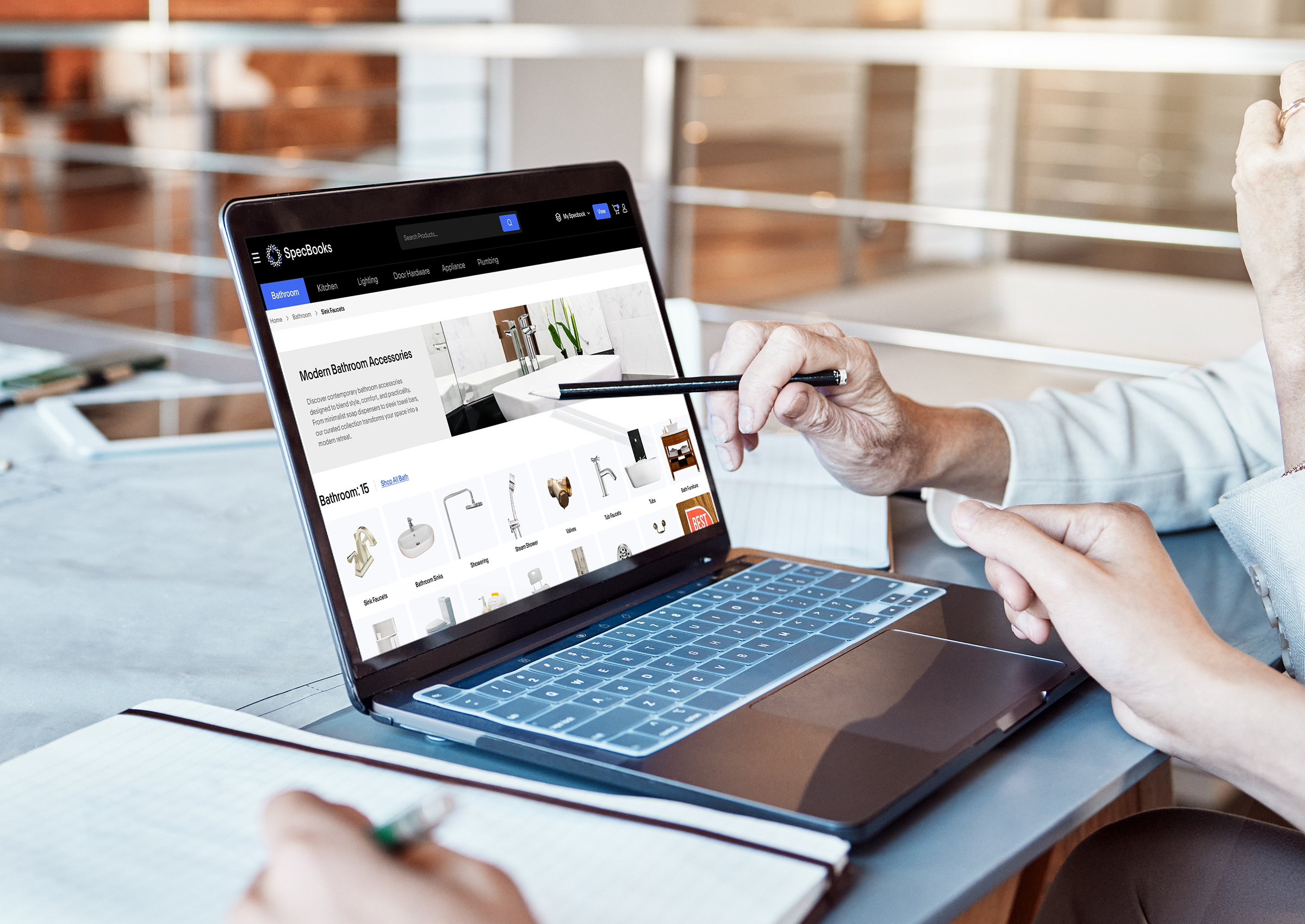 Image of a laptop open. One person is showing another person plumbing items on SpecBooks market.