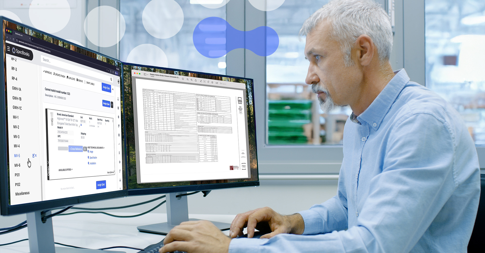 Image of a man in a backroom office, there is a warehouse in the background. The man is looking at two screens, the screen on the right has a fixture schedule opened, the screen on the left has SpecBooks.